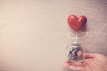 hand-holding-a-jar-of-heart-tree-growing-on-money-coins-social 360 x 240